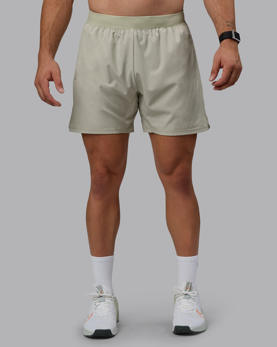 Man wearing Challenger 6&quot; Performance Shorts - Sustained Grey