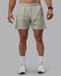 Man wearing Challenger 6" Performance Shorts - Sustained Grey