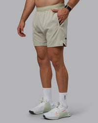 Man wearing Challenger 6" Performance Shorts - Sustained Grey