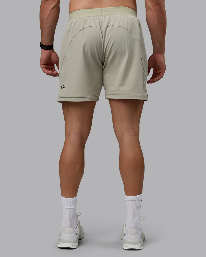 Man wearing Challenger 6&quot; Performance Shorts - Sustained Grey
