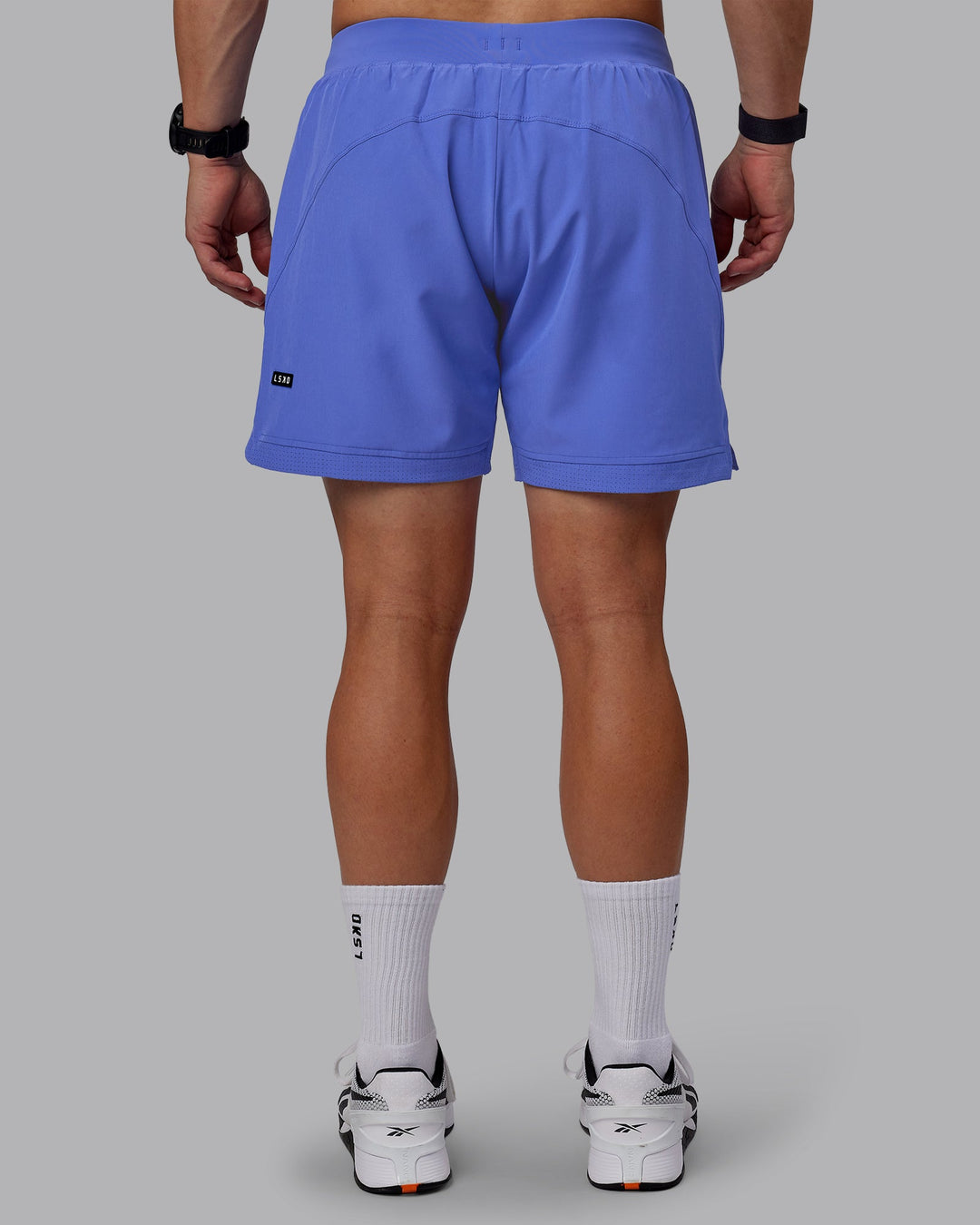 Man wearing Challenger 6&quot; Performance Shorts - Baja Blue