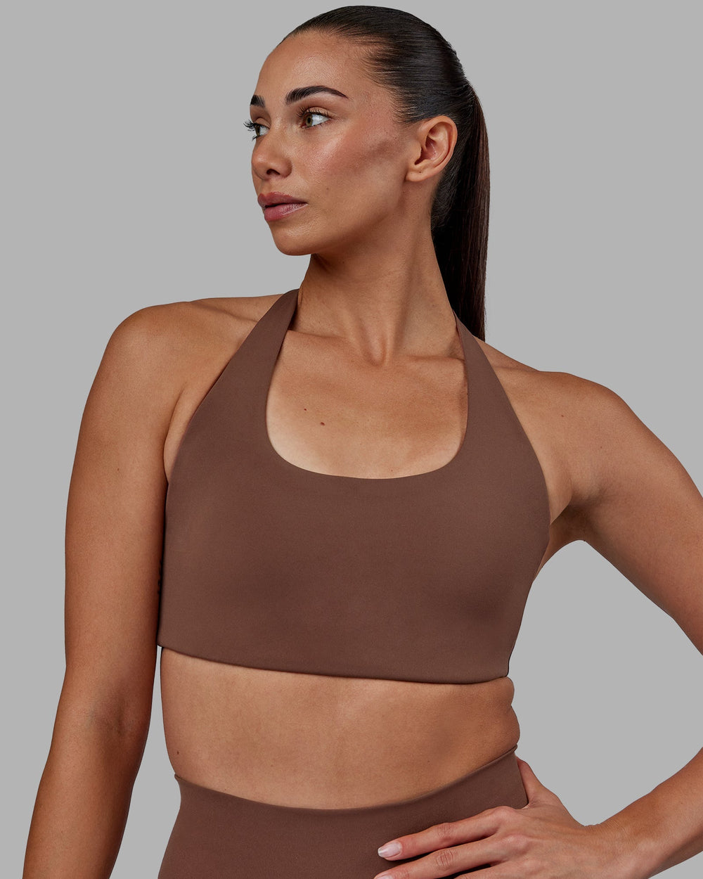 Woman wearing Challenger Sports Bra - Dull Rust