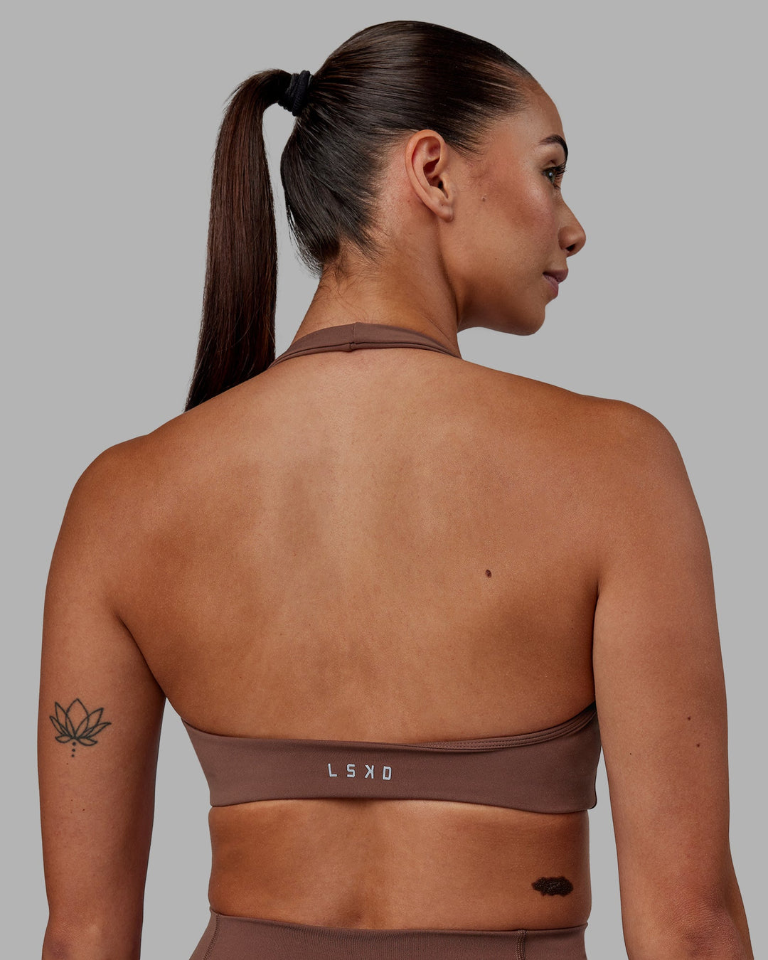 Woman wearing Challenger Sports Bra - Dull Rust