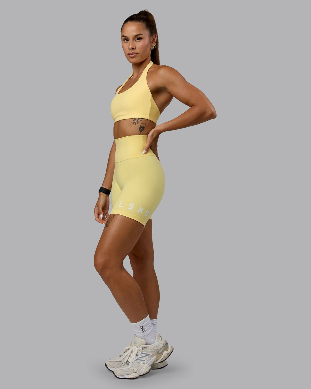 Woman wearing Challenger Sports Bra - Lemon