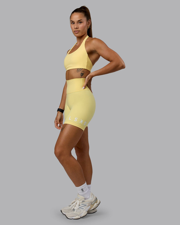 Woman wearing Challenger Sports Bra - Lemon
