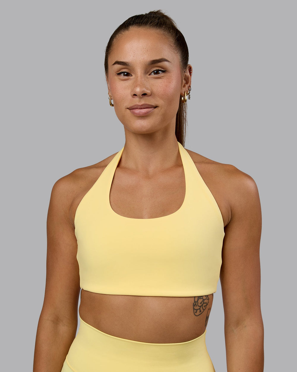 Woman wearing Challenger Sports Bra - Lemon