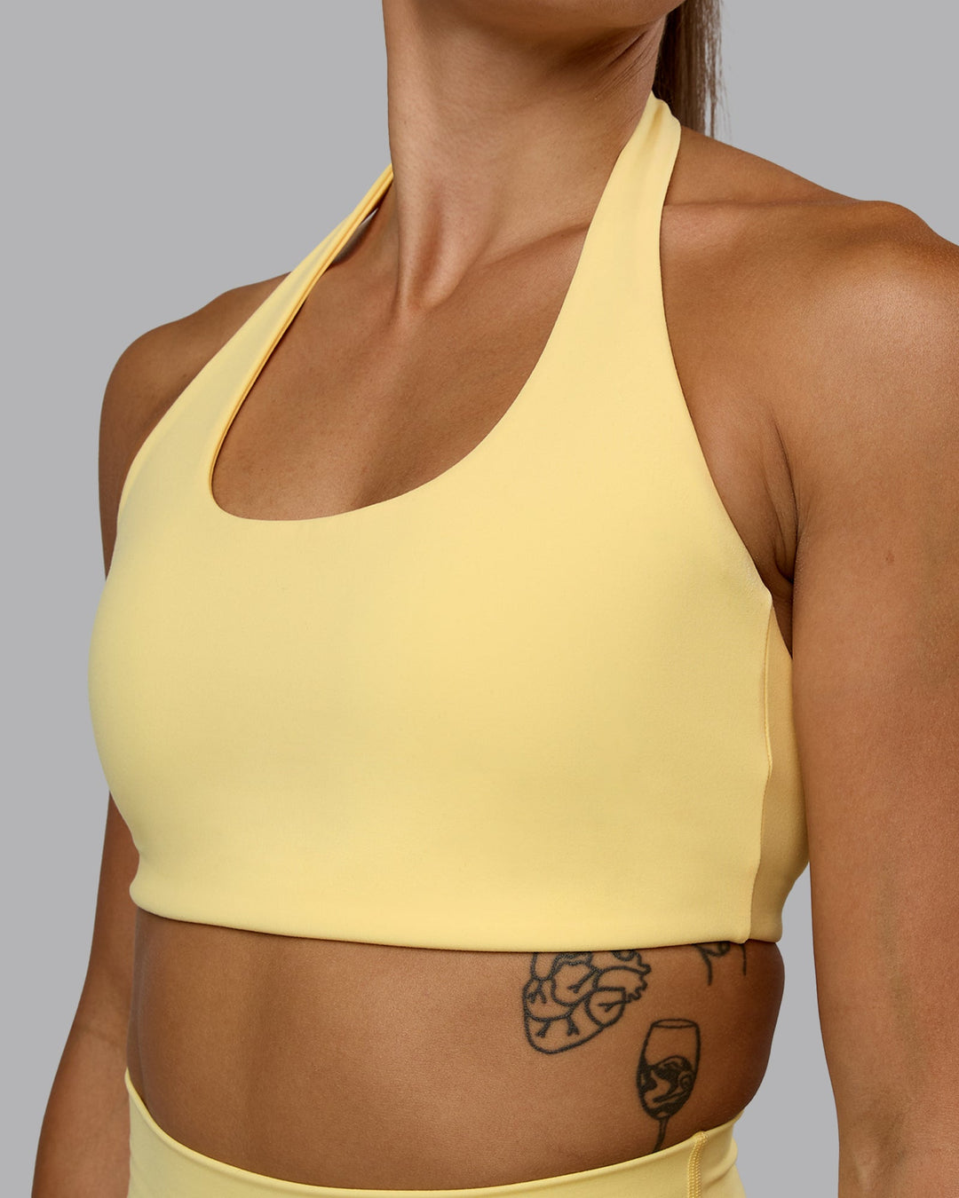 Woman wearing Challenger Sports Bra - Lemon