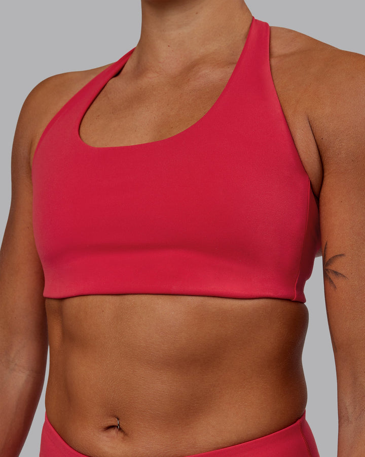 Woman wearing Challenger Sports Bra - Scarlet
