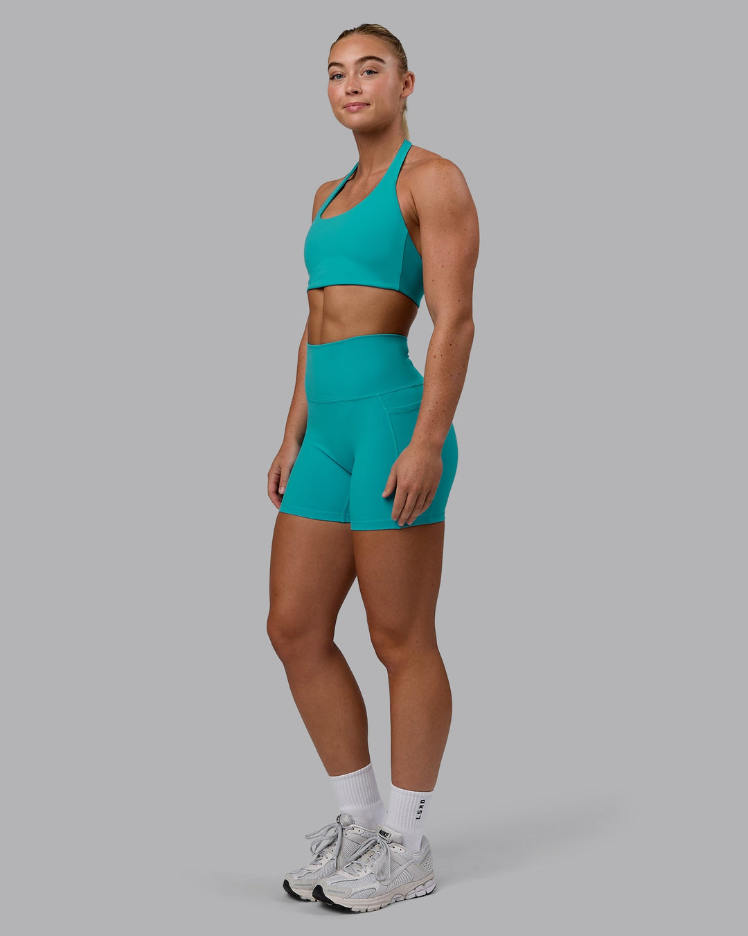 Woman wearing Challenger Sports Bra - Uplift Blue