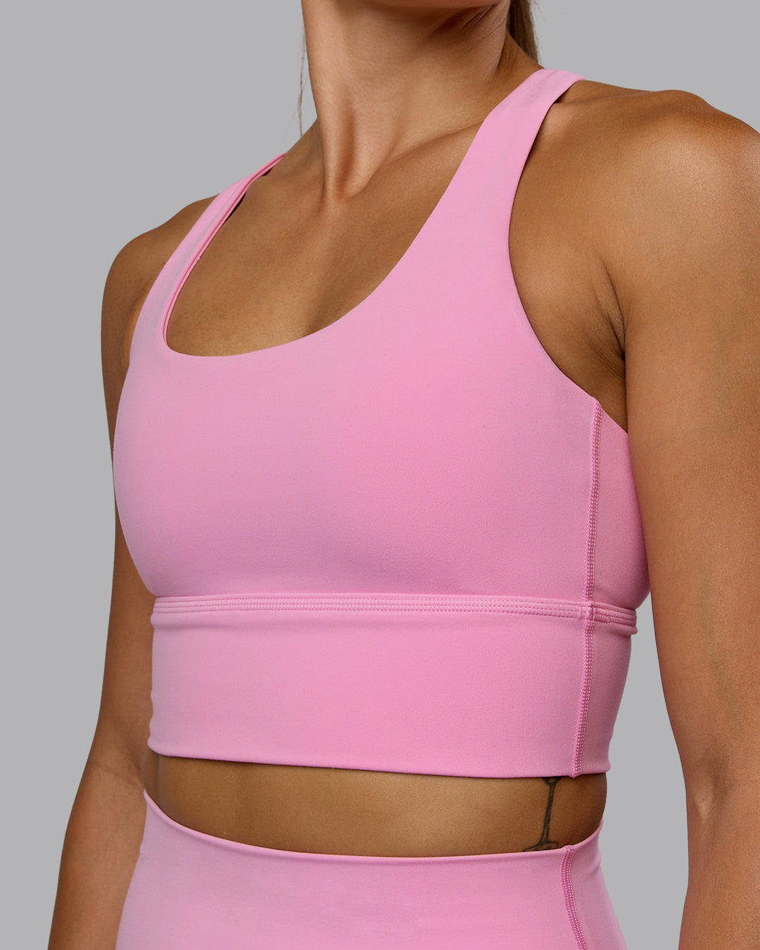 Woman wearing Circuit Sports Bra - Bubblegum