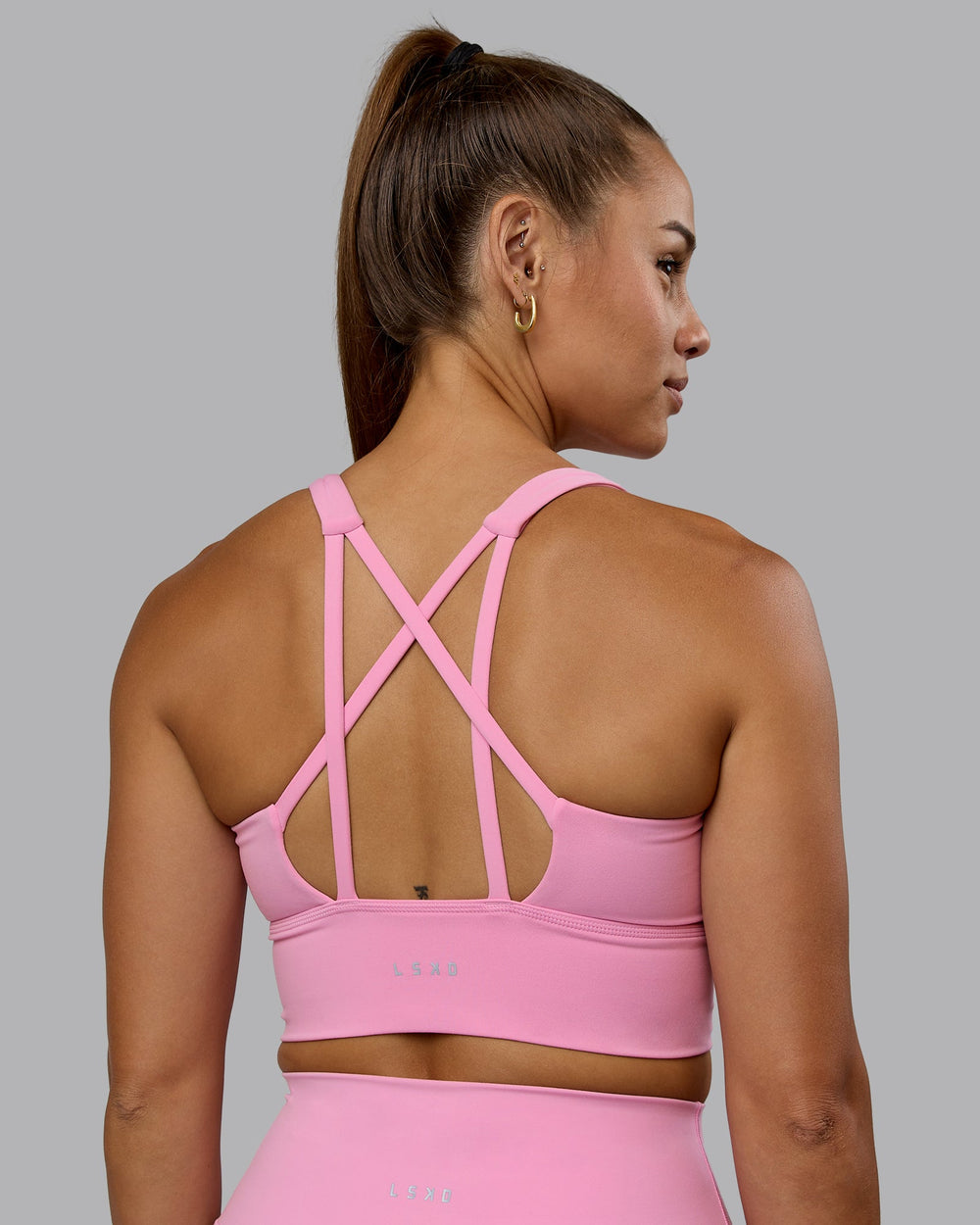 Woman wearing Circuit Sports Bra - Bubblegum