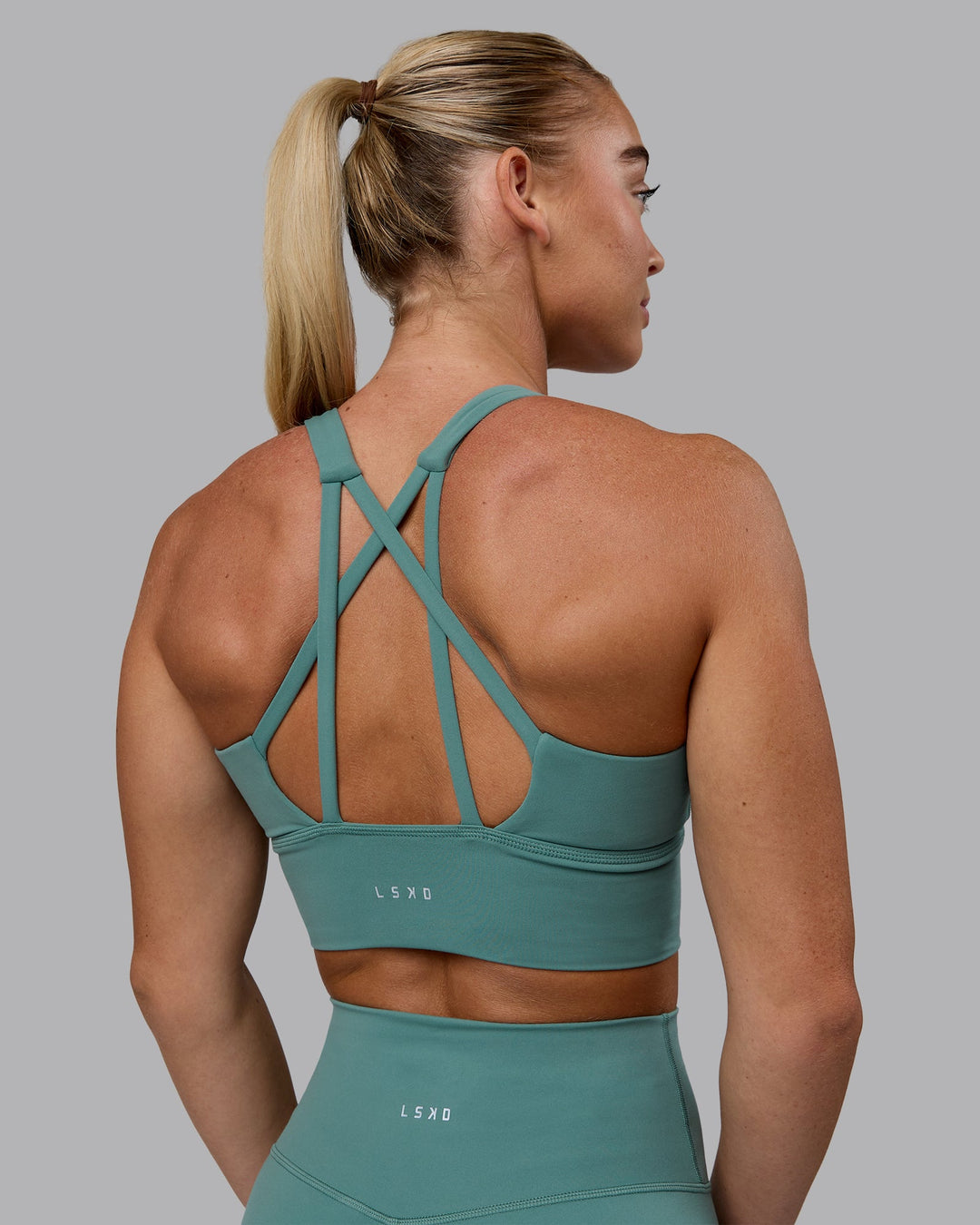 Woman wearing Circuit Sports Bra - Sagebrush