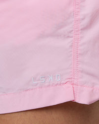 Man wearing Classic 5" Shorts - Pale Pink