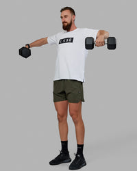 Man wearing Competition 5" Performance Short - Forest Night