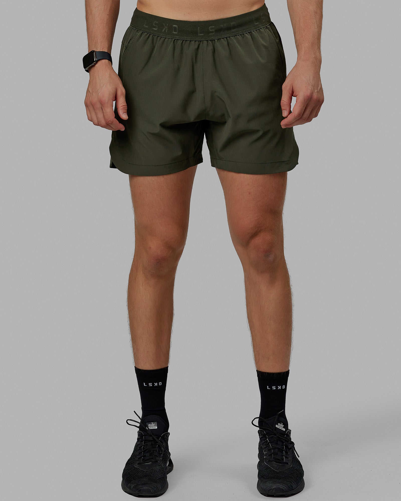 Man wearing Competition 5" Performance Short - Forest Night