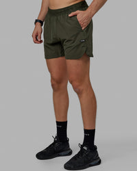 Man wearing Competition 5" Performance Short - Forest Night
