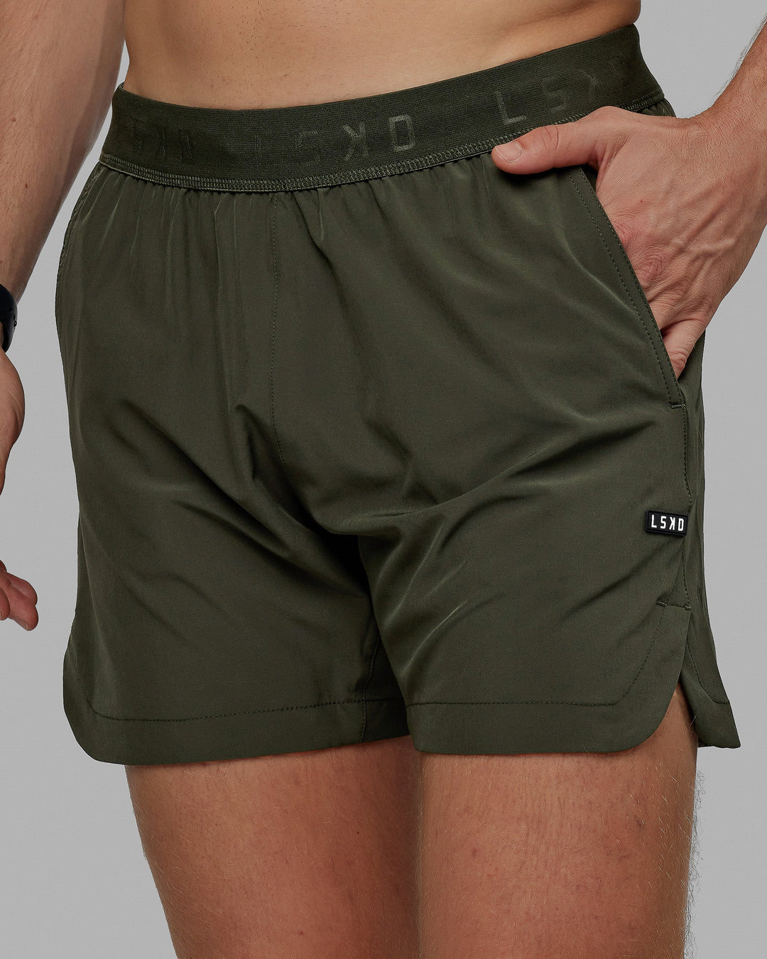 Man wearing Competition 5" Performance Short - Forest Night