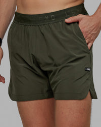 Man wearing Competition 5" Performance Short - Forest Night