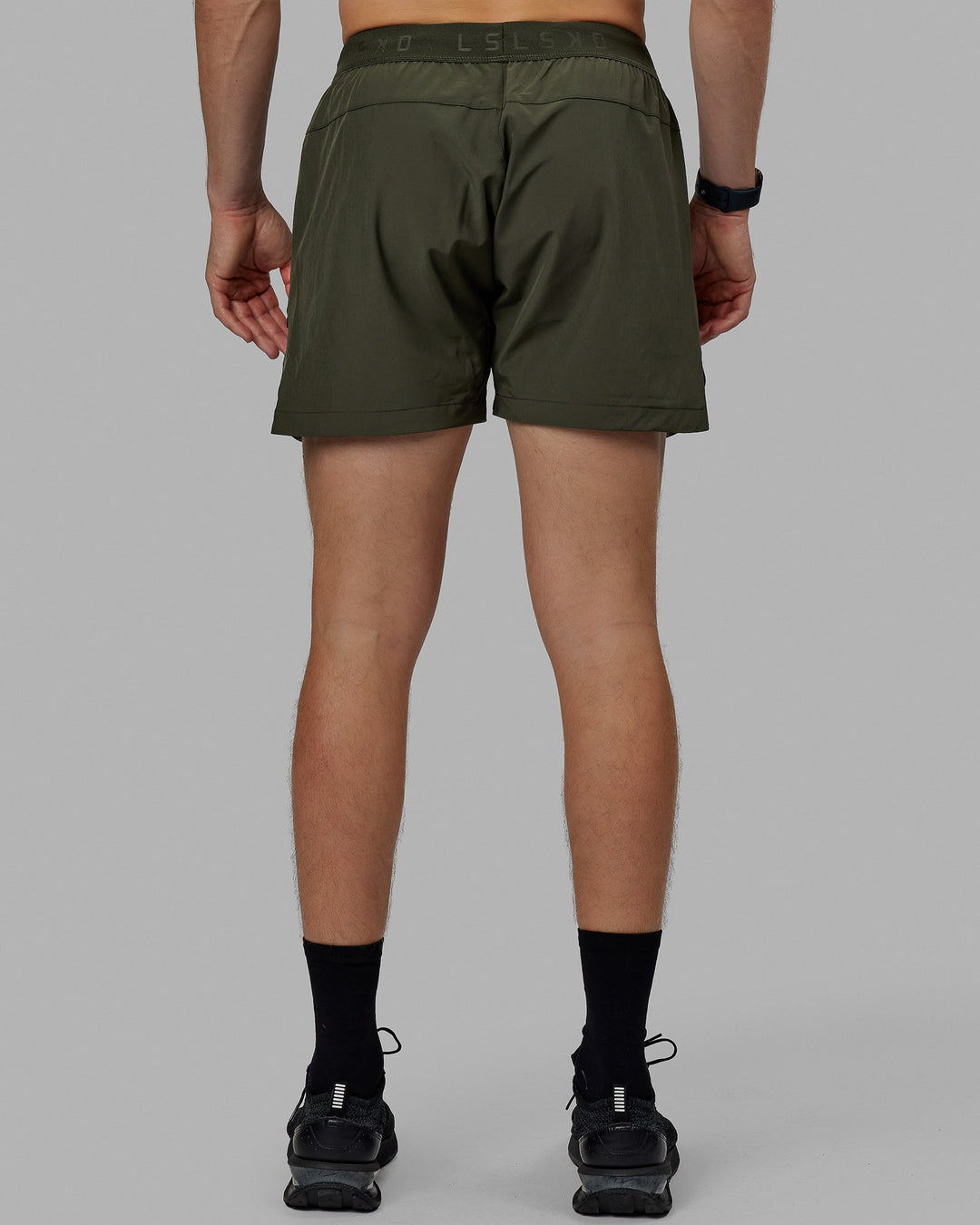 Man wearing Competition 5" Performance Short - Forest Night