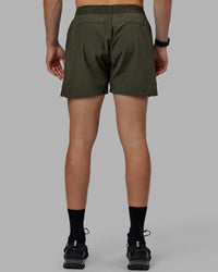 Man wearing Competition 5" Performance Short - Forest Night