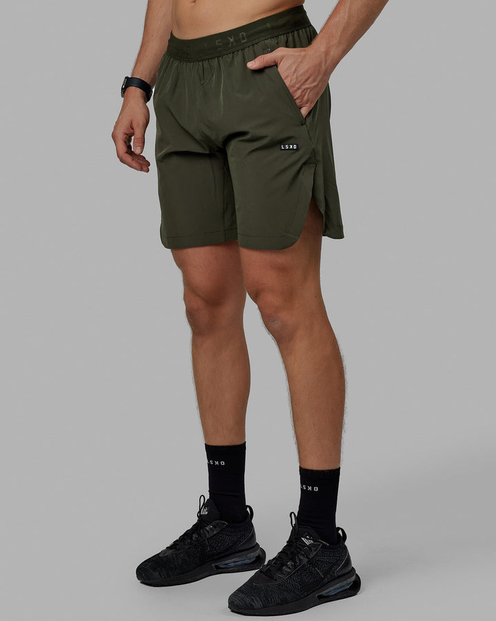 Man wearing Competition 8" Performance Short - Forest Night