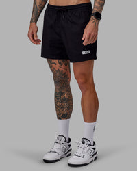 Man wearing Daily 5" Shorts - Black-White