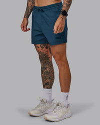 Man wearing Daily 5" Shorts - Indigo