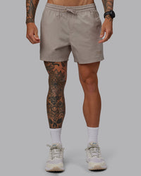 Man wearing Daily 5" Shorts - Shale Beige