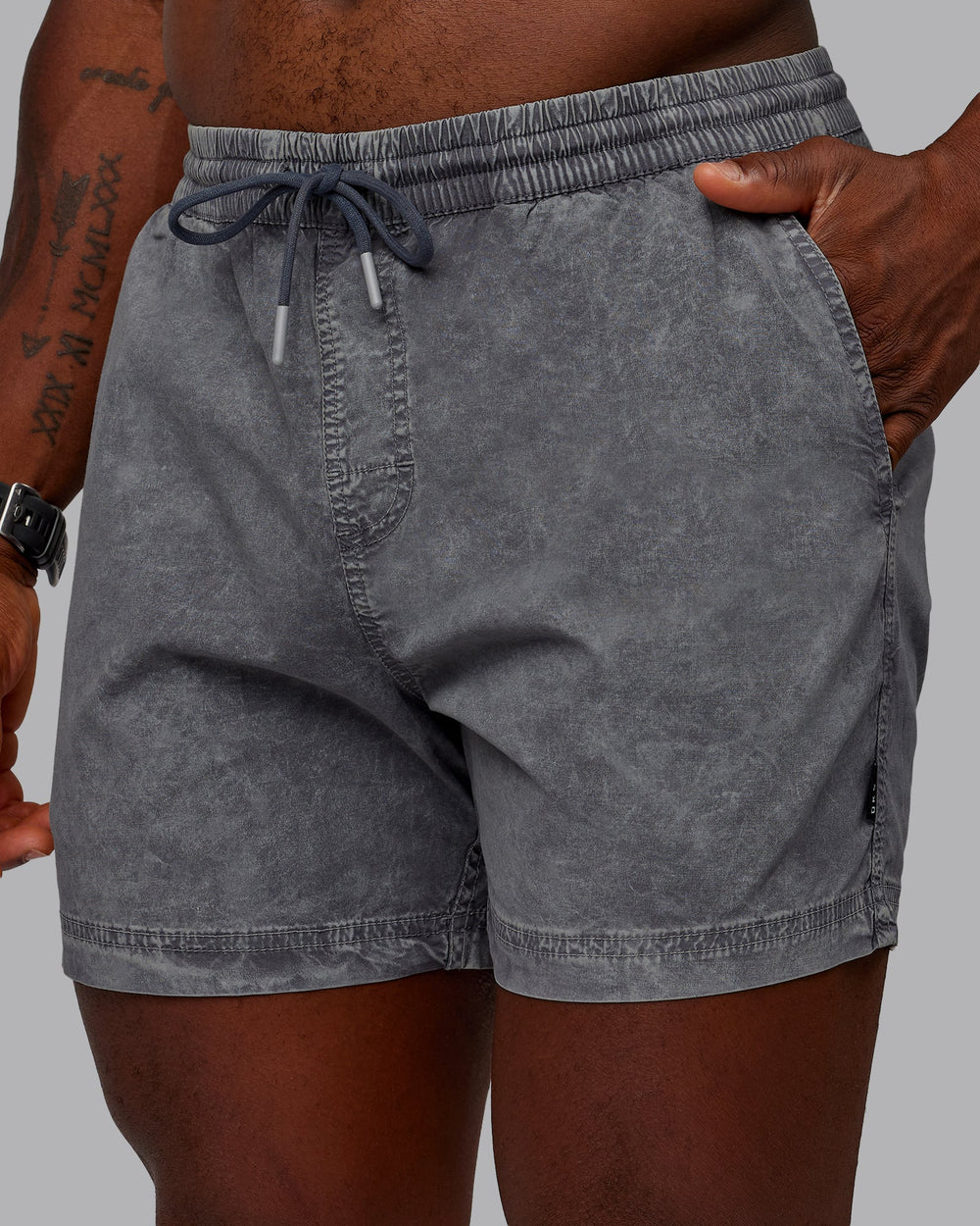 Man wearing Washed Daily 5" Shorts - Circular Grey