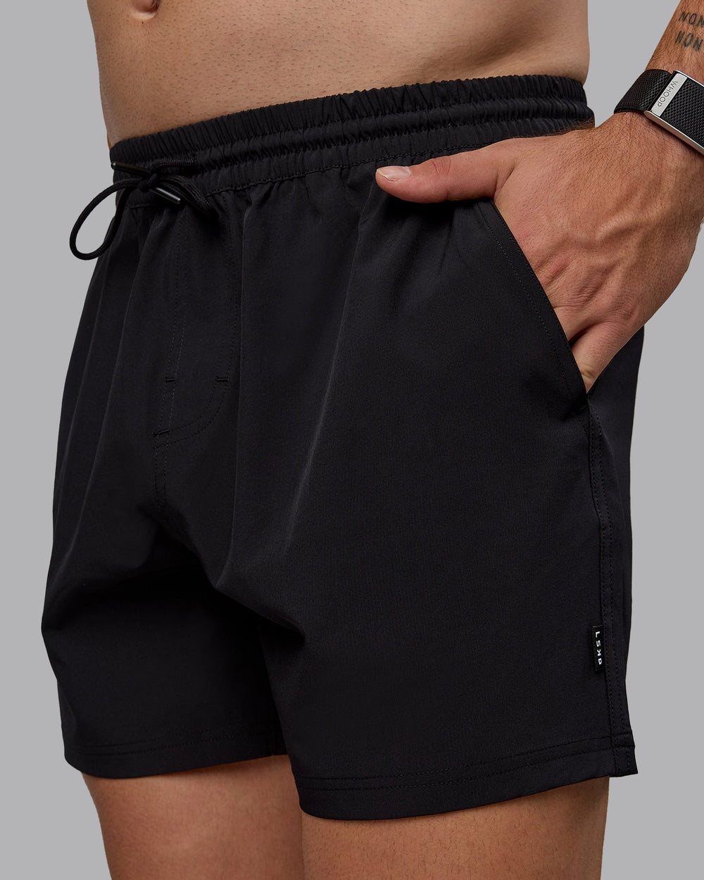 Man wearing Daily 5" Swim Shorts - Black