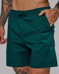 Man wearing Daily 7" Shorts - Dark Moss