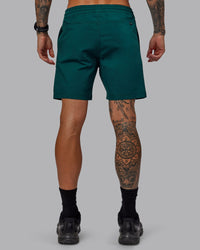 Man wearing Daily 7" Shorts - Dark Moss