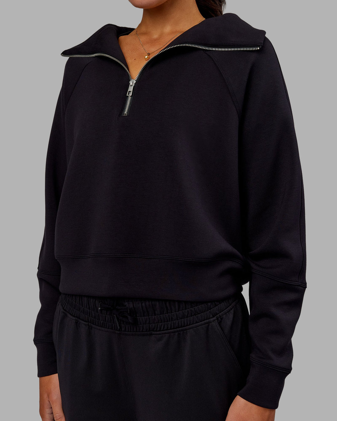 Woman wearing Elevate SoftTouch 1/2 Zip Sweater - Black-Black