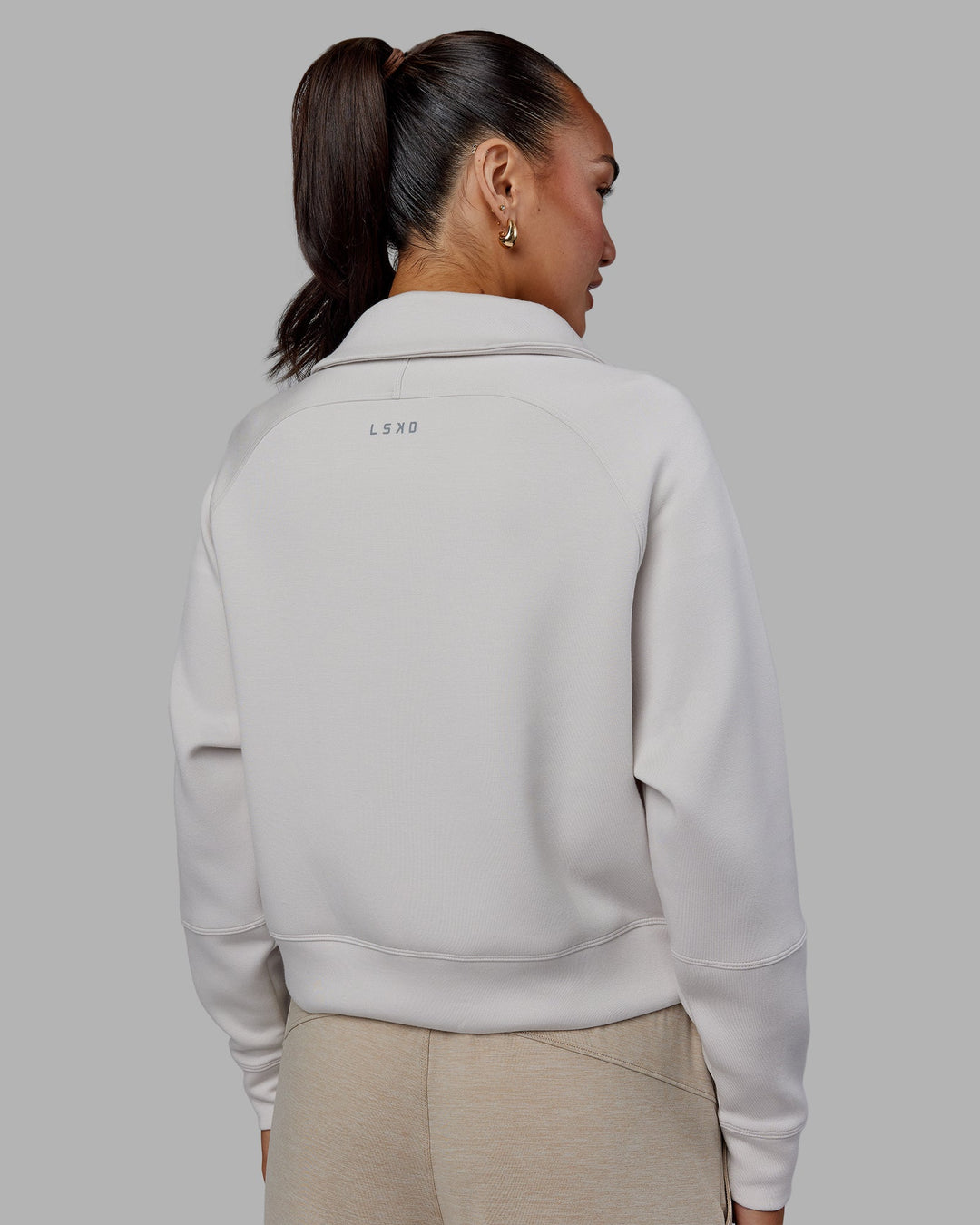 Woman wearing Elevate SoftTouch 1/2 Zip Sweater - Clay-Clay