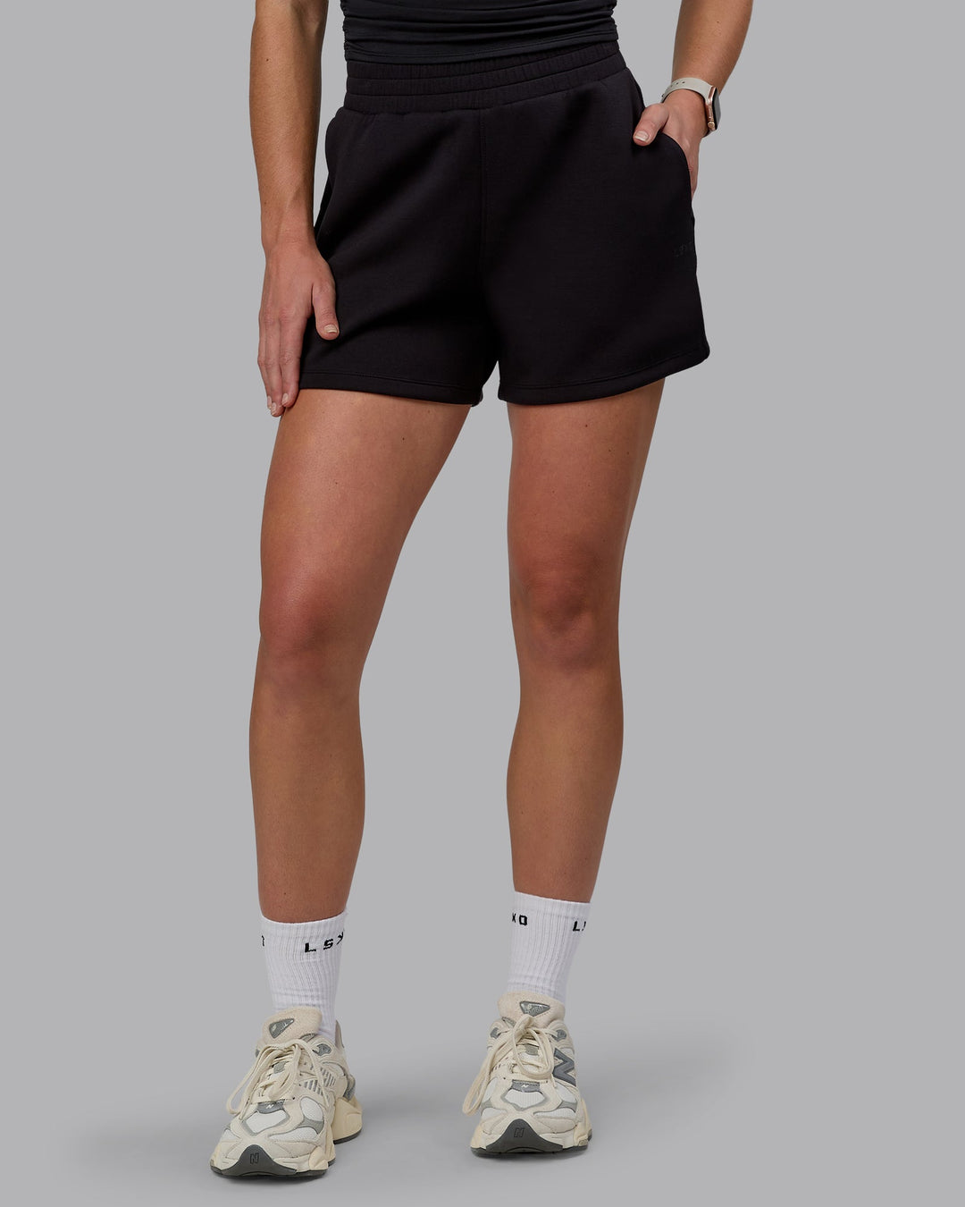 Woman wearing Elevate SoftTouch 4" Shorts - Black-Black