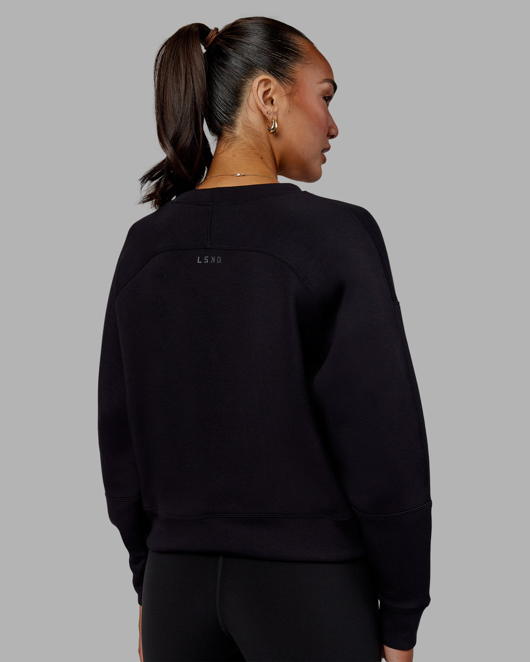 Woman wearing Elevate SoftTouch Crew Neck Sweater - Black-Black