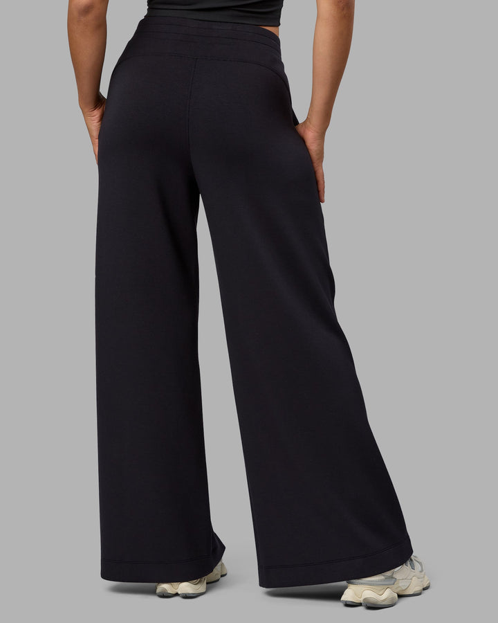 Woman wearing Elevate SoftTouch Wide Leg Pants - Black-Black
