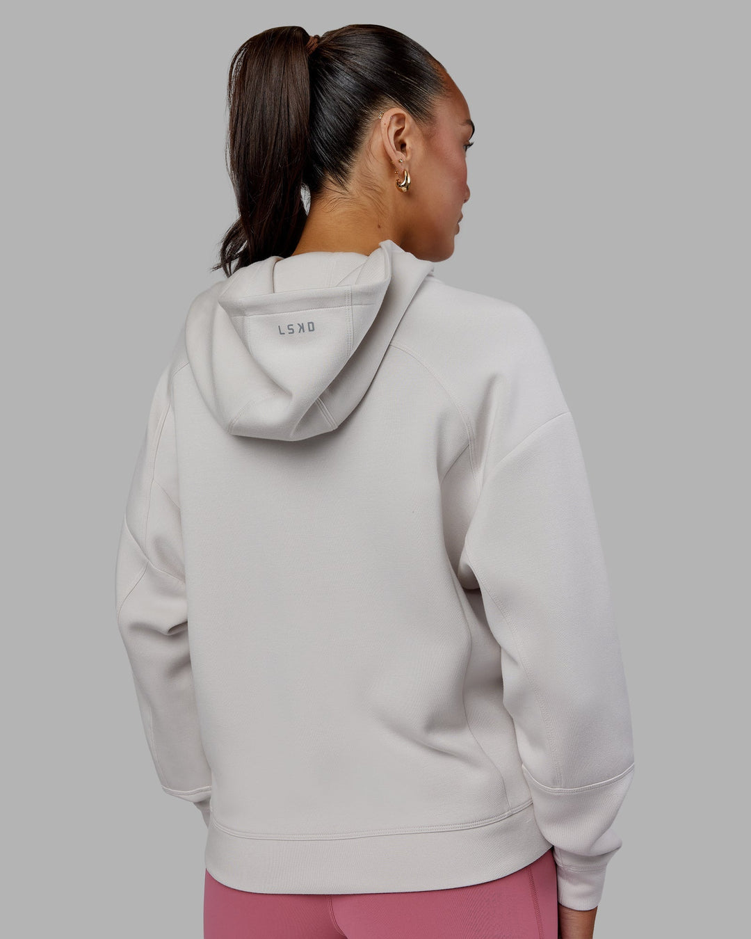 Woman wearing Elevate SoftTouch Zip Through Hoodie - Clay-Clay