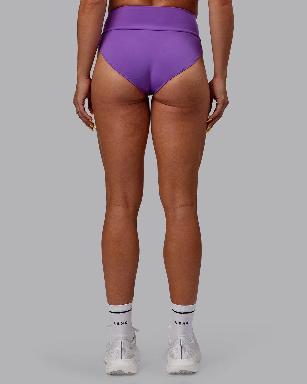 Woman wearing Elevate Sprinting Briefs - Purple Swirl