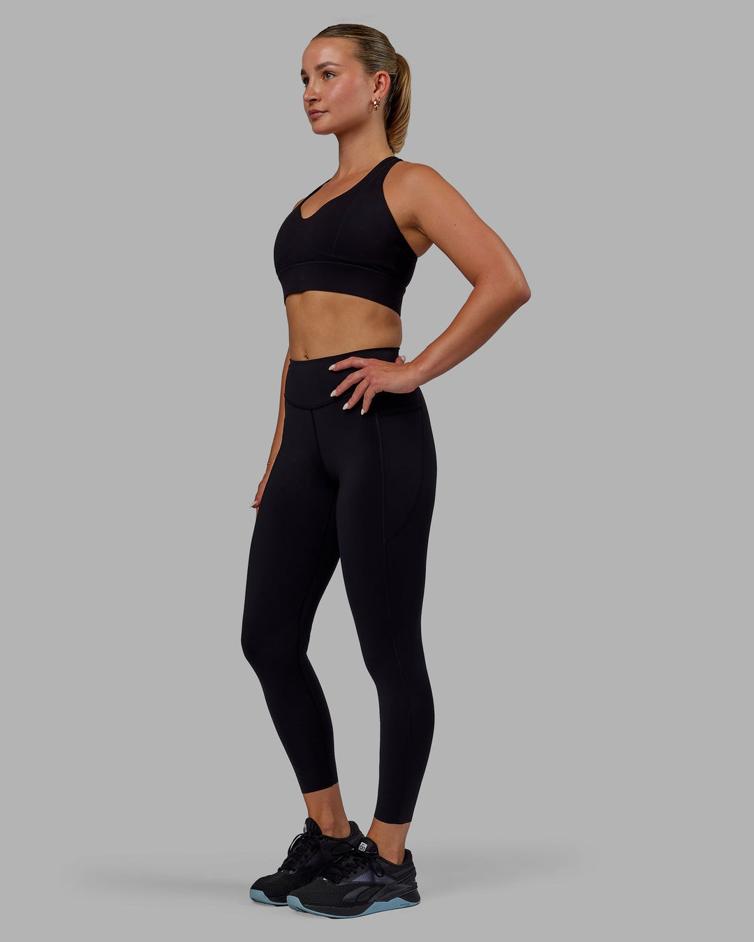 Woman wearing Elite 7/8 Length Leggings - Black