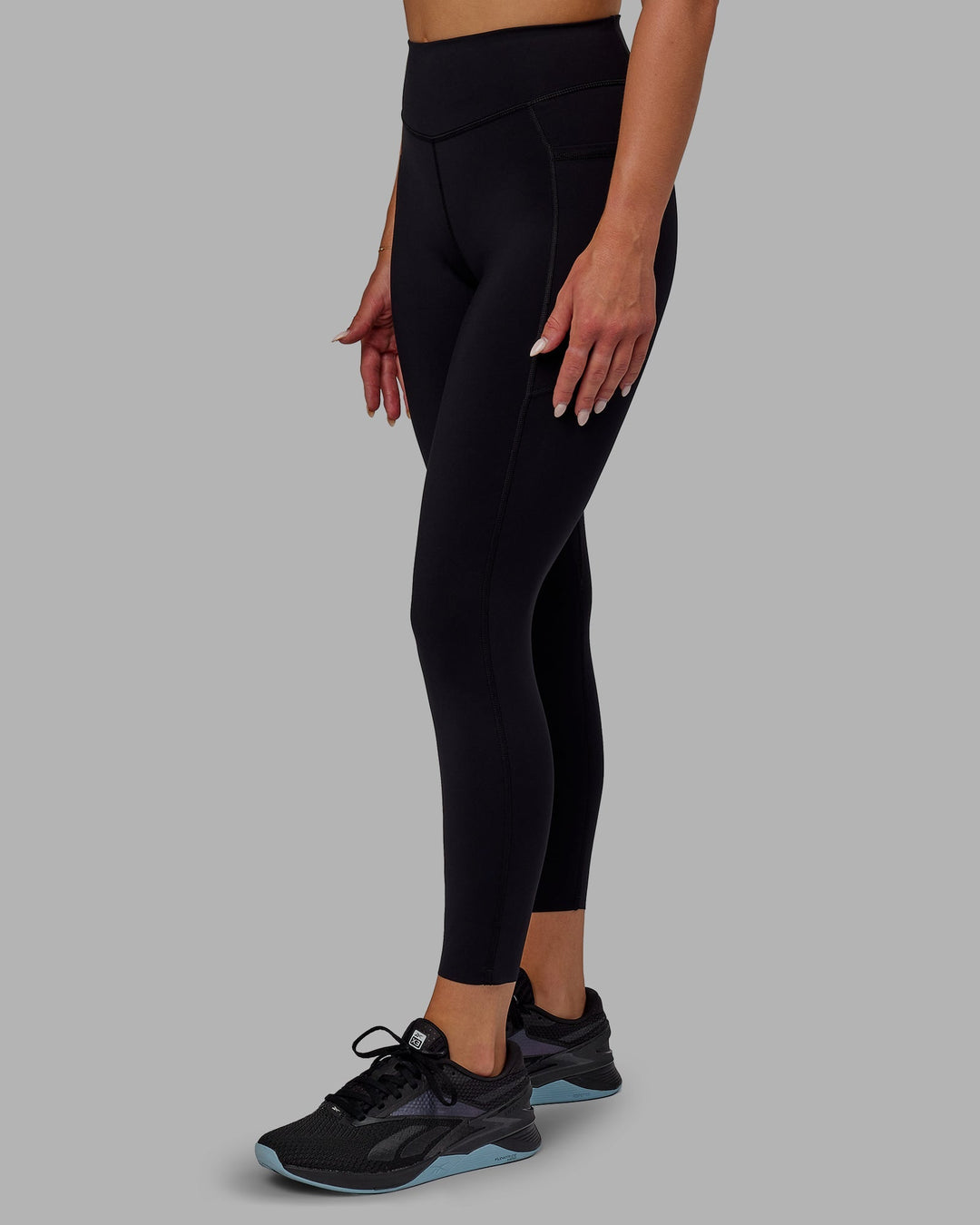 Woman wearing Elite 7/8 Length Leggings - Black