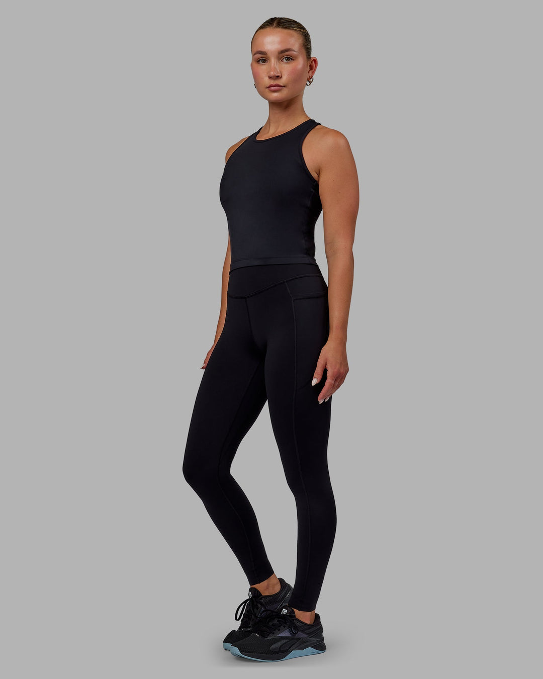 Woman wearing Elite Full Length Leggings - Black