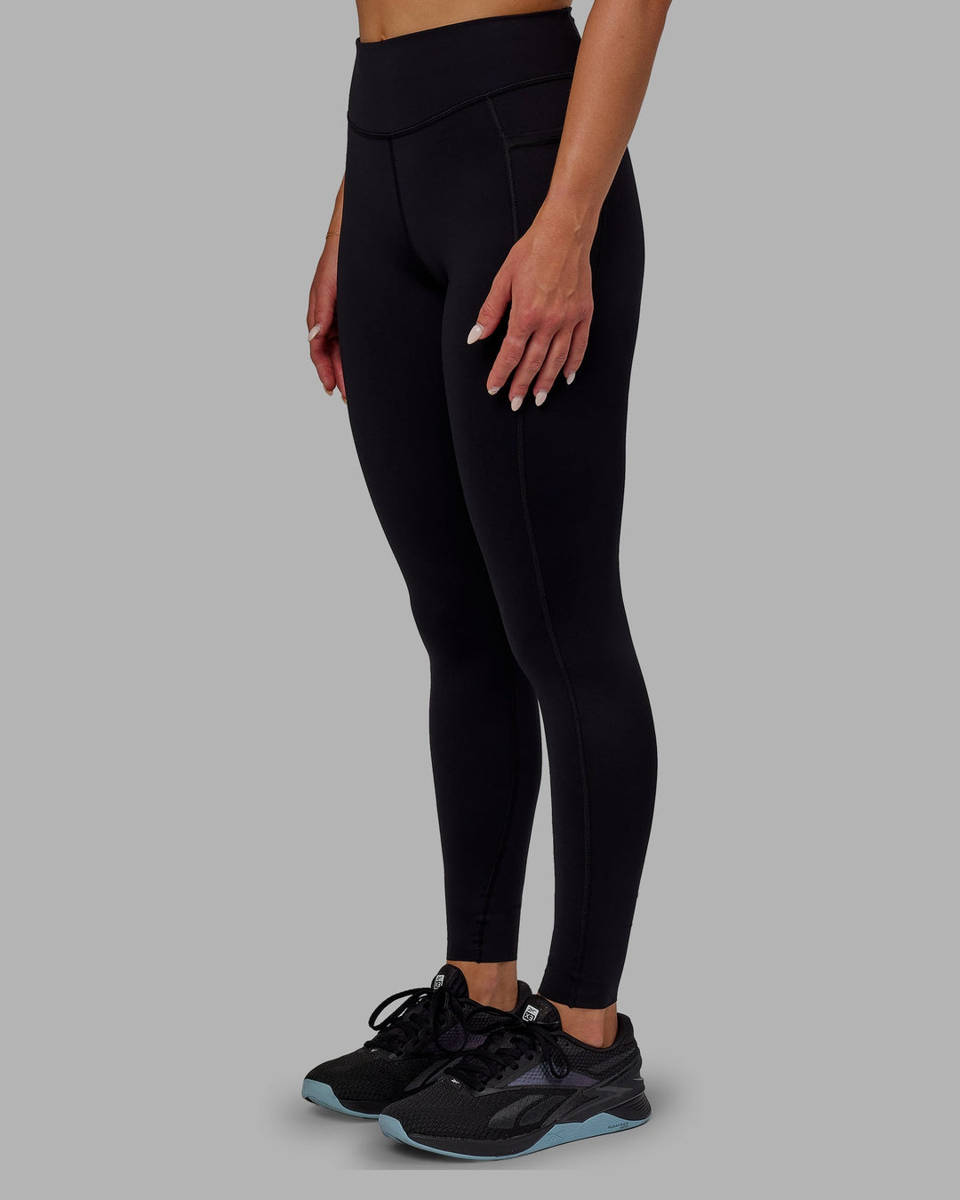 Woman wearing Elite Full Length Leggings - Black