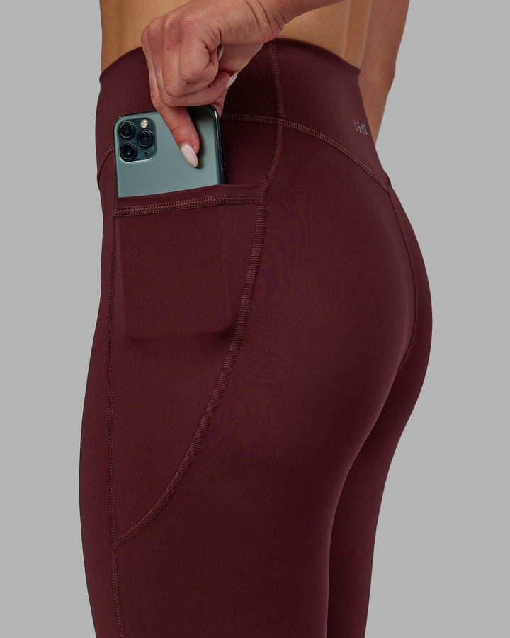 Woman wearing Elite Full Length Leggings - Dark Cherry
