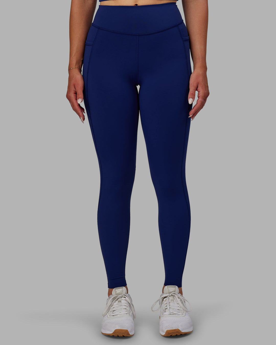 Woman wearing Elite Full Length Leggings - Midnight Blue