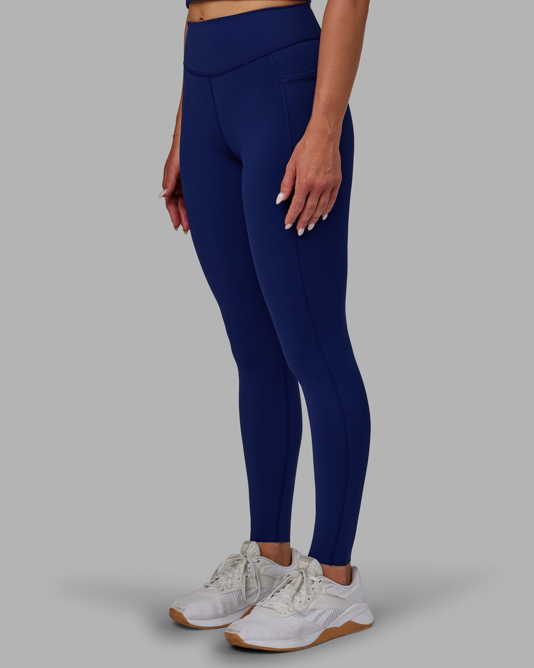 Woman wearing Elite Full Length Leggings - Midnight Blue