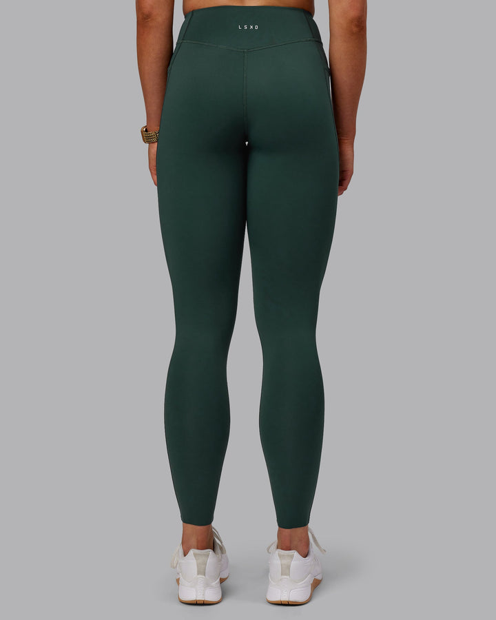 Woman wearing Elite Full Length Leggings - Vital Green
