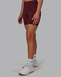 Woman wearing Elite High-Rise 6" Short Pockets - Dark Cherry