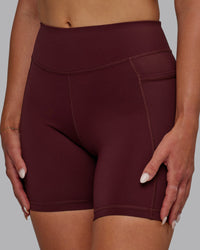 Woman wearing Elite High-Rise 6" Short Pockets - Dark Cherry