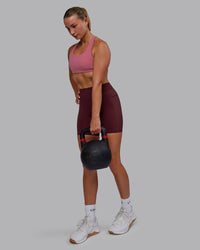 Woman wearing Elite High-Rise 6" Short Pockets - Dark Cherry